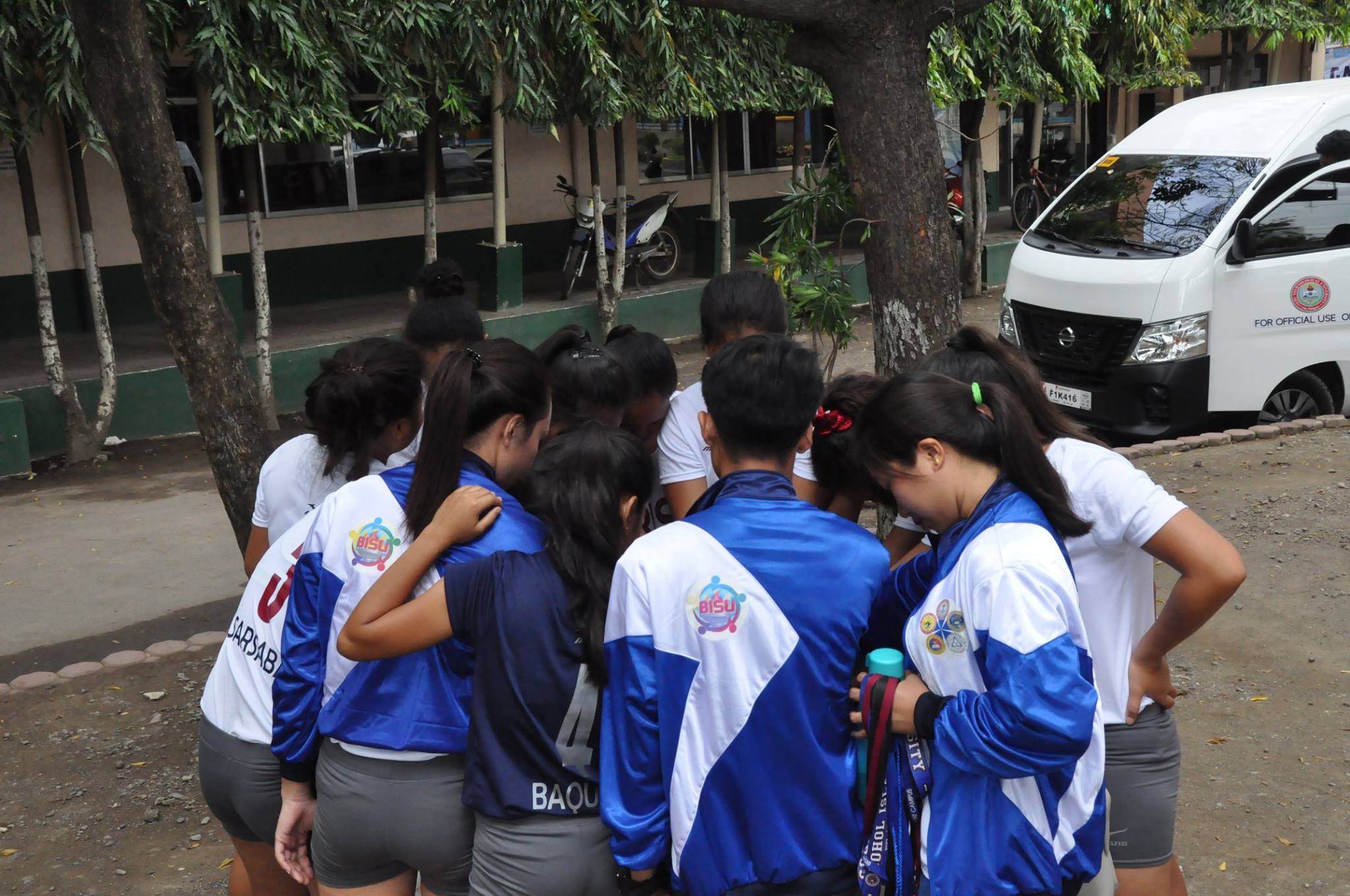 Volleyball players huddle